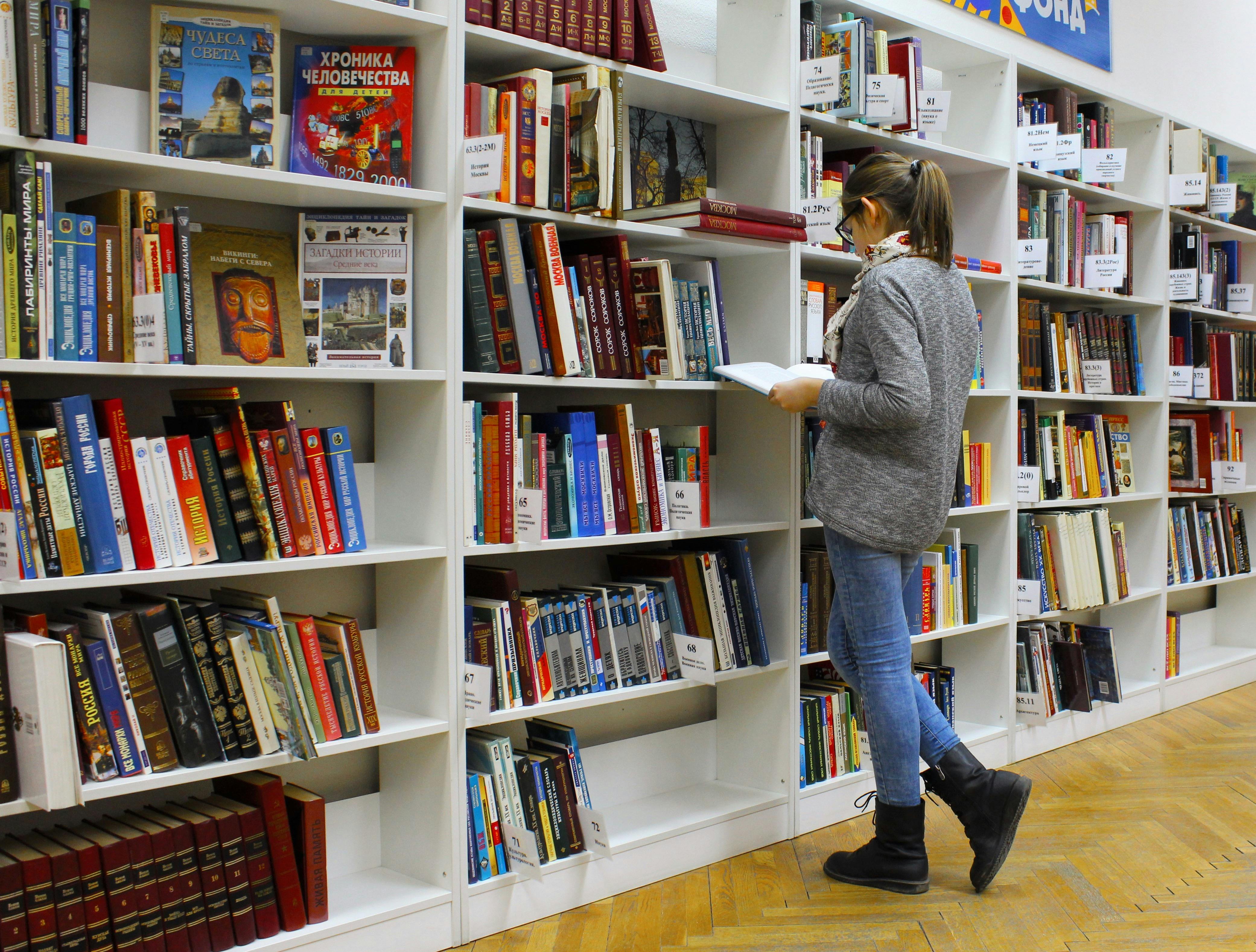 Person looking at multiple language texts